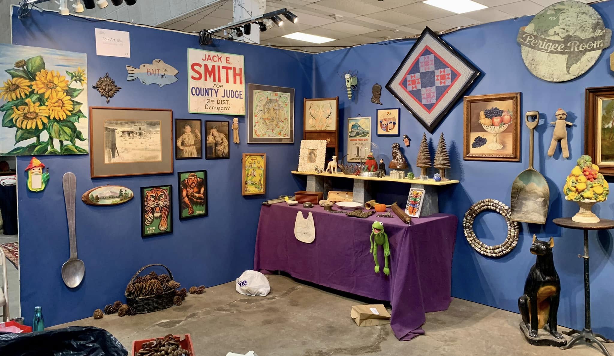Americana collectibles and folk art on vibrant blue wall